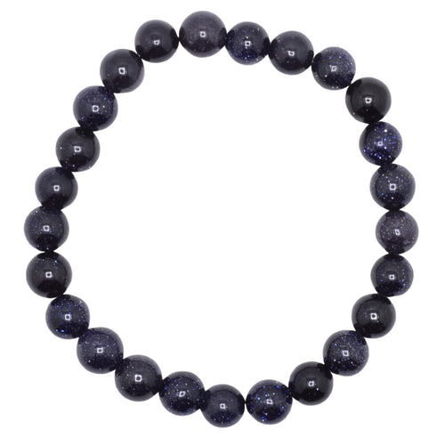 A beaded stretch bracelet made of dark, polished blue goldstone round beads, arranged in a circle on a plain white background.