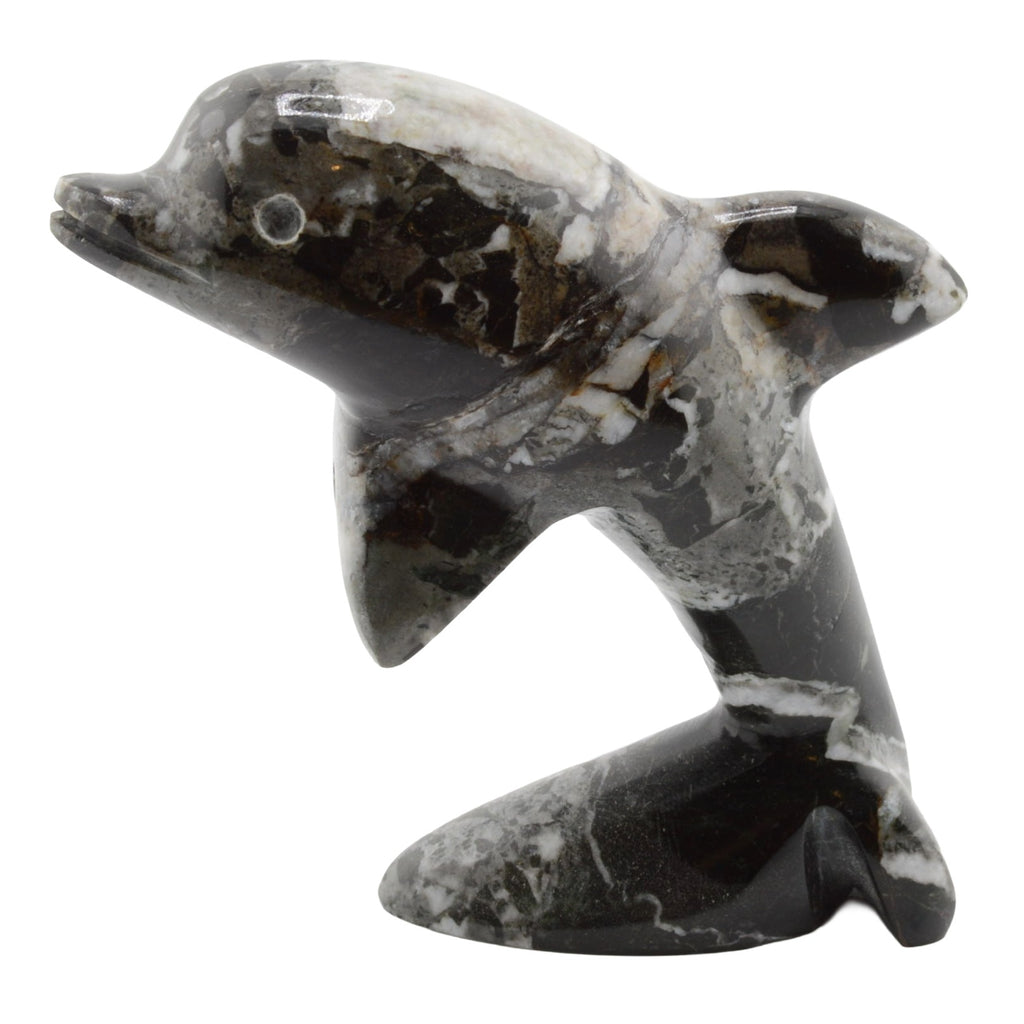 A polished black and white marbled stone dolphin figurine, shown against a plain white background.