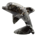 A polished black and white marbled stone dolphin figurine, shown against a plain white background.