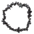 Black obsidian chip bracelet Jewellery made of polished irregular chips, arranged in a circle on a plain white background.