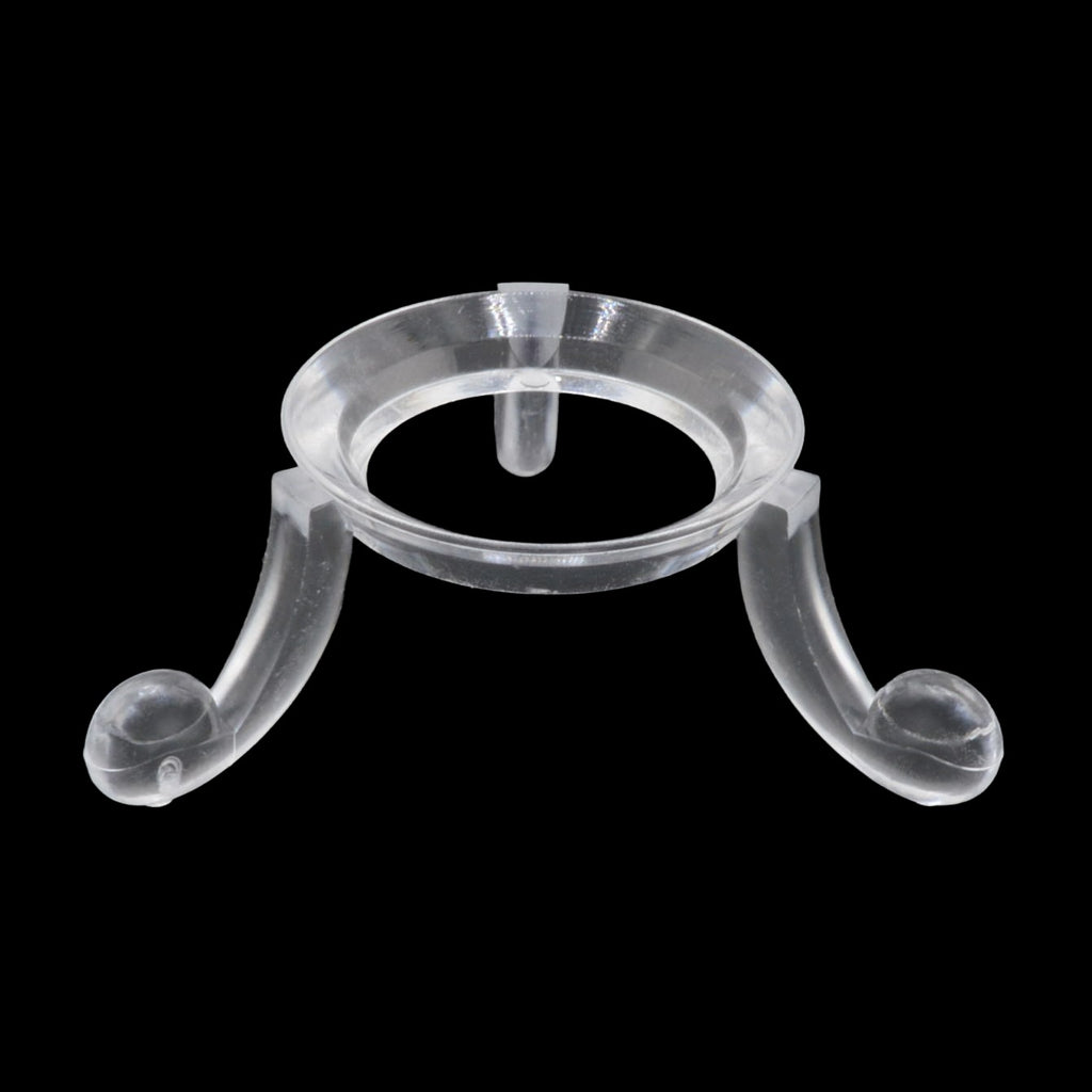 A clear acrylic jewelry display stand with a circular top and two curved legs, shown against a solid black background.