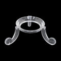 A clear acrylic jewelry display stand with a circular top and two curved legs, shown against a solid black background.