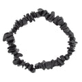A black shungite gemstone chip bracelet arranged in a circle on a plain white background.