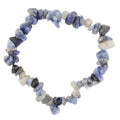 A beaded stretch bracelet made of irregular, polished blue and gray sodalite gemstone chips, arranged in a circle on a plain white background.