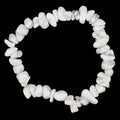 A white howlite gemstone chip bracelet in white with grey veining, arranged in a circle on a dark textured background.